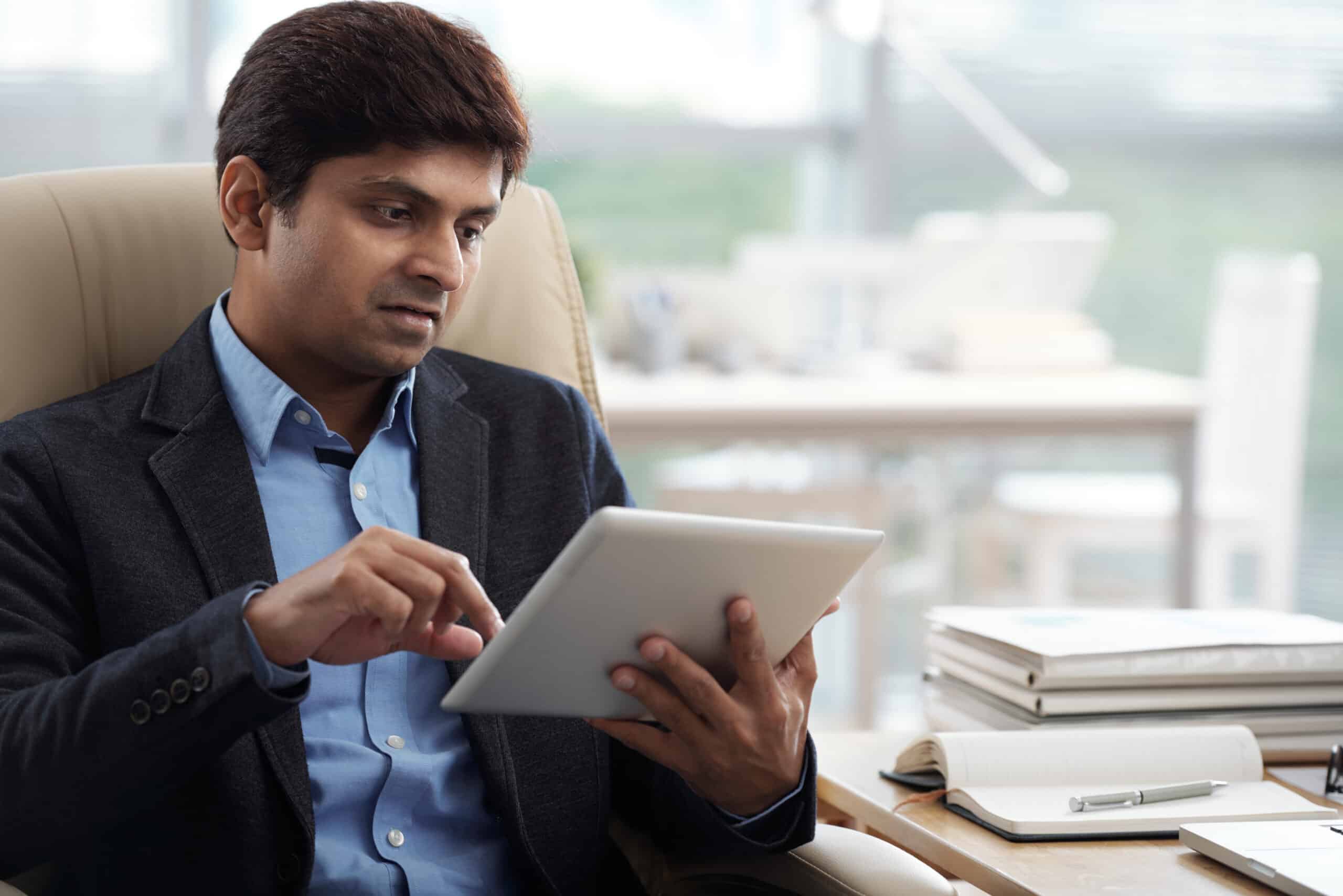 Businessman working on digital tablet